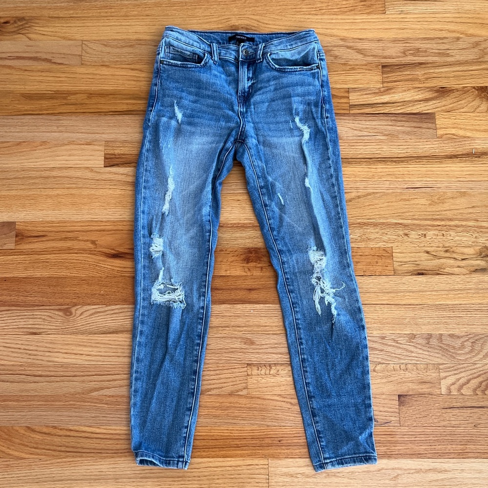 Forever 21 blue ripped jeans. Girl size Small